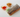 Beef bulgogi spring roll wrapped in translucent rice paper with lettuce and vegetables, served with sweet chili sauce and dipping sauce