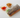 Beef bulgogi spring roll wrapped in translucent rice paper with lettuce and vegetables, served with sweet chili sauce and dipping sauce
